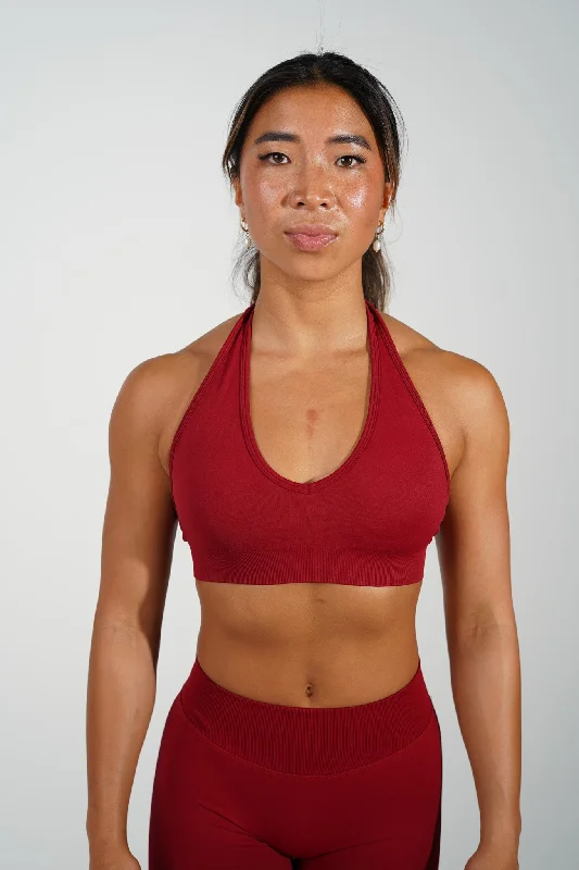 Sports top with firm shape -RECOIL HALTER CROP - DARK RED